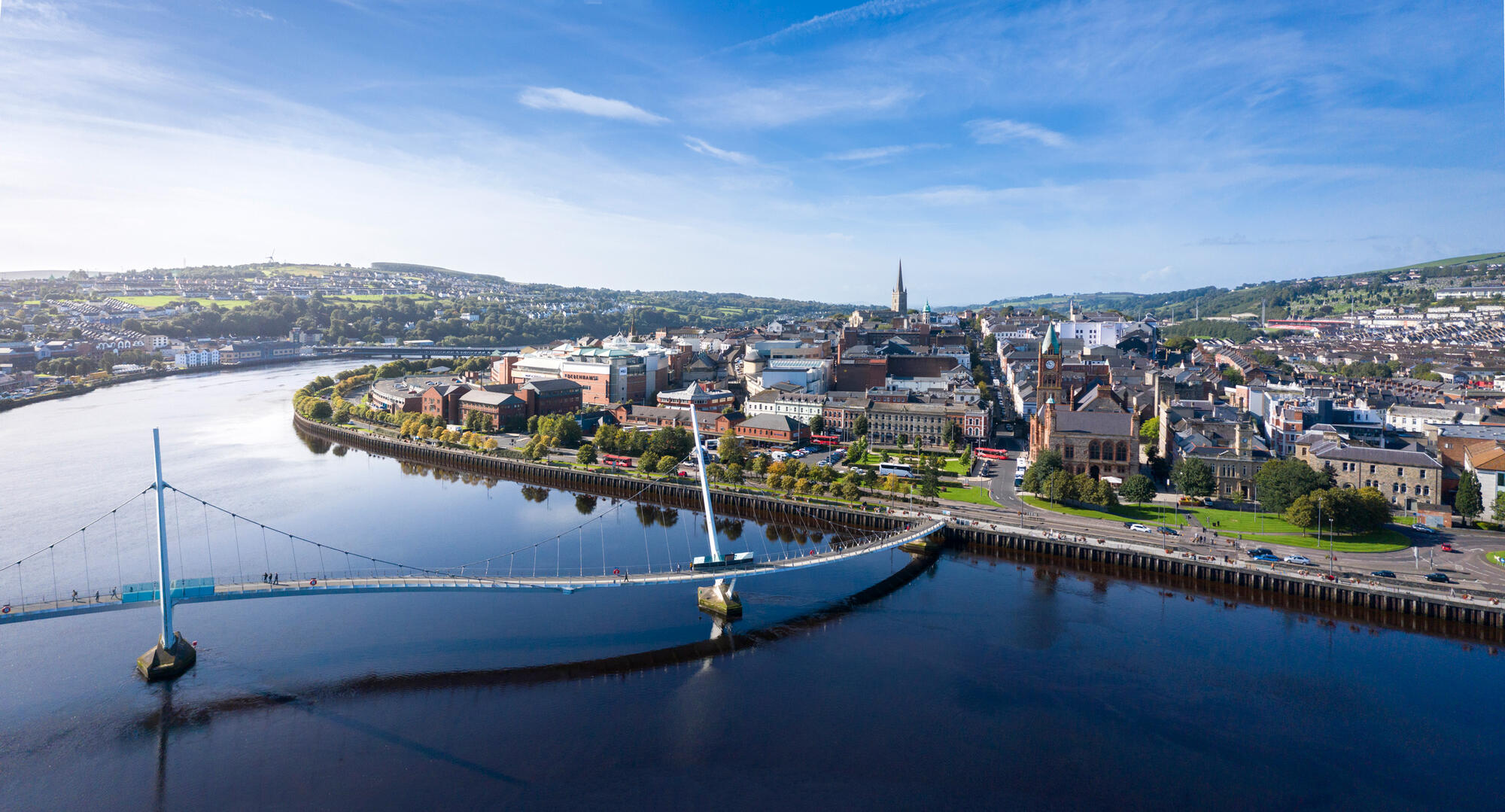 Aerial view of Derry~Londonderry, The Peace Bridge and the River Foyle.